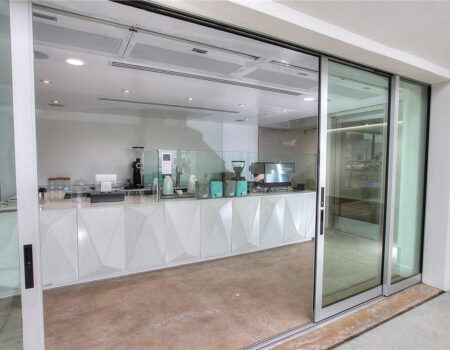 Berner Architectural Recessed 12 air curtain over cafe main entrance.