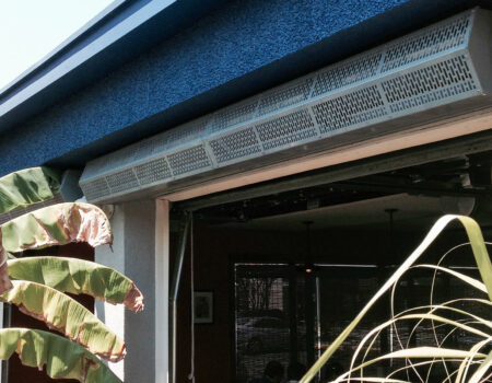 Berner's Sanitation Certified Low Profile 7 air curtain over patio entrance.