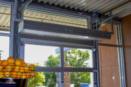 Berner Architectural Low Profile 8 air curtain over grocery store garage door opening.