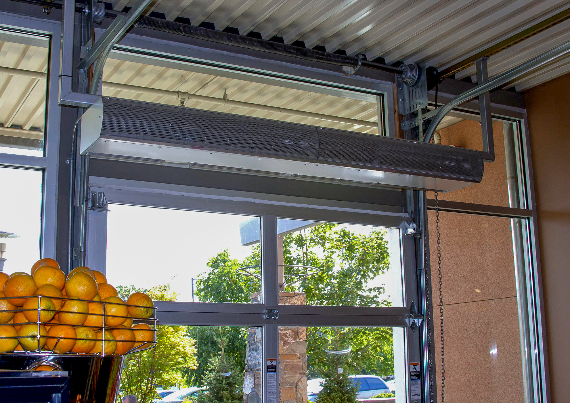 Berner Architectural Low Profile 8 air curtain over grocery store garage door opening.