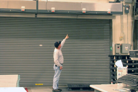 Berner's Industrial Direct Drive 12 air curtain over rollup doors at Yonkers Industries.