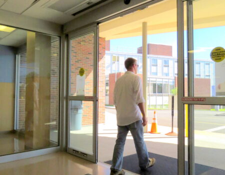 Berner's Architectural Recessed 12-16 over automatic entrance doors of hospital