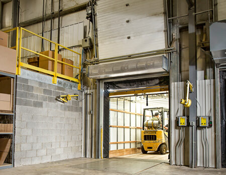 Berner's Industrial Direct Drive 12 and 14 Air Curtains over warehouse loading dock door
