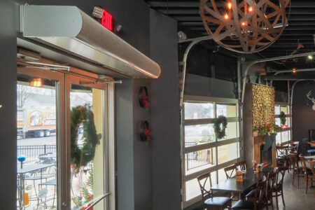 Berner's Architectural Low Profile 8 air curtain over restaurant main entrance.