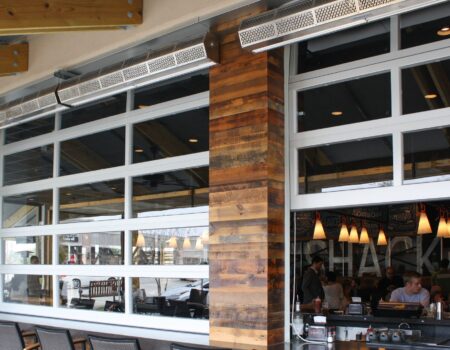 Berner's sanitation certified low profile 7 air curtain installed over indoor/outdoor bar opening