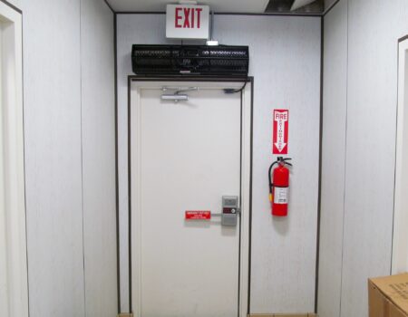 Berner's Sanitation Certified Low Profile 7 air curtain installed over back door service entry