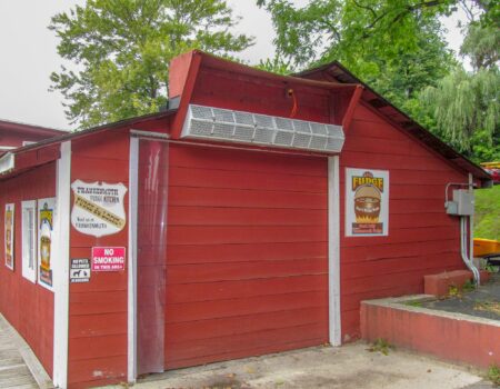 Berner's Sanitation Certified High Performance 7 Air Curtain mounted outside over service window of concession stand