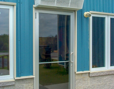 Berner's Sanitation Certified High Performance 7 Air Curtain over office employee entrance