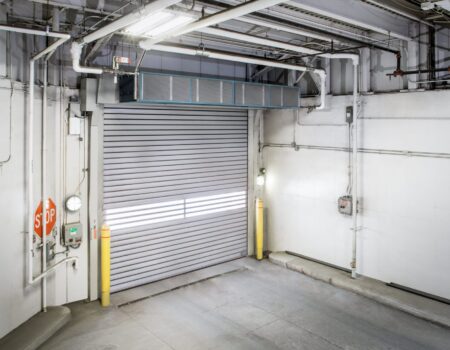 Berner Hazardous Location Air Curtain Series over bus garage door entrance.