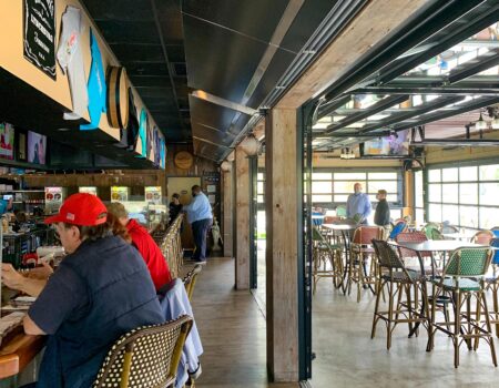 Berner's Architectural Elite 10 Air Curtain protecting indoor outdoor bar and patio.