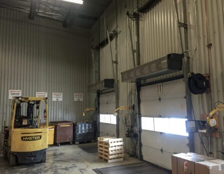 Berner's Industrial Direct Drive 12-14 Air Curtain installed with extension brackets.