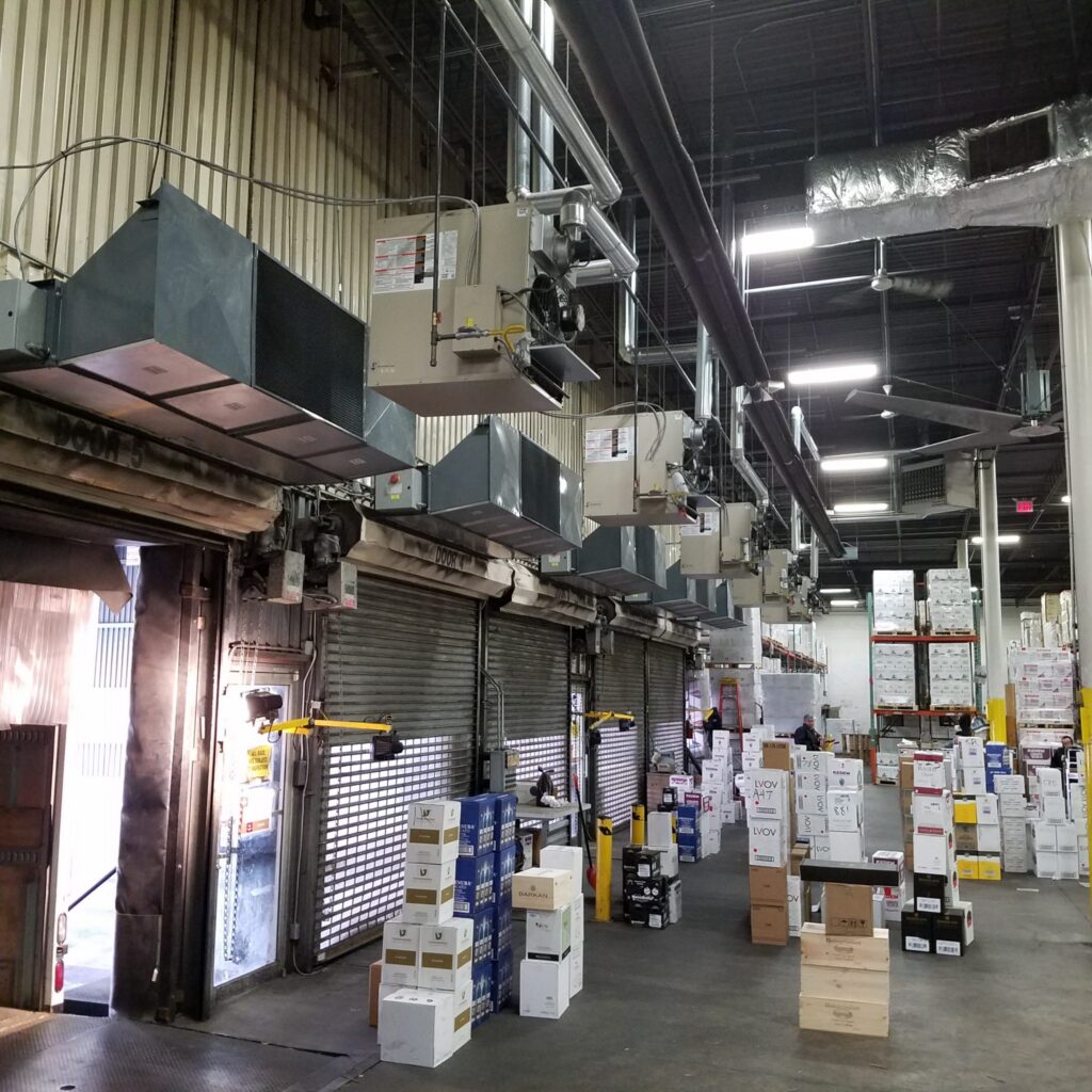 5 Berner Industrial Direct Drive Air Curtains over shipping receiving doors at Royal Wine