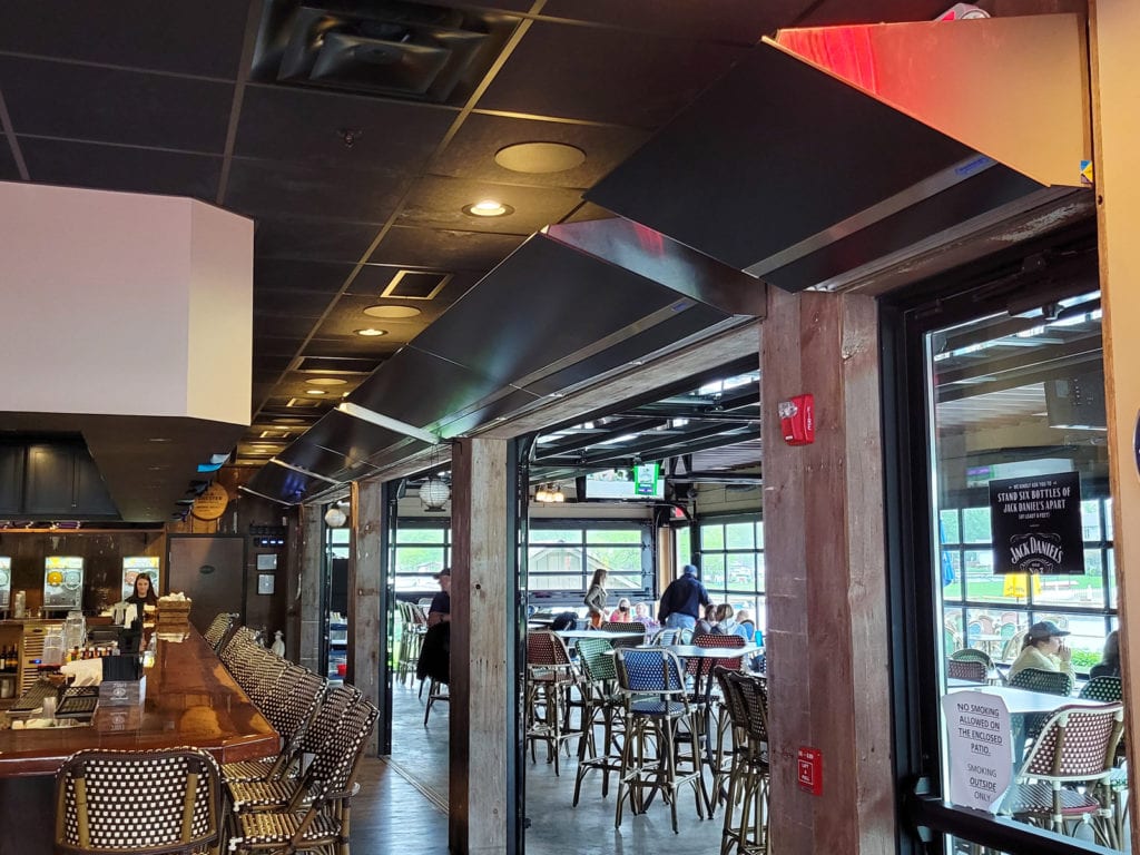 Berner's Architectural Elite 10 Air Curtain protecting indoor outdoor bar and patio.