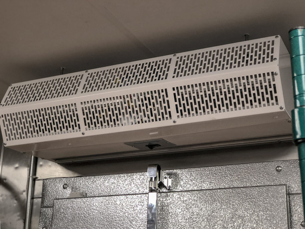 Berner's Commercial Low Profile 8 air curtain close-up on walk-in cooler.