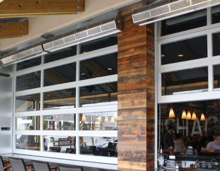 Berner's Sanitation Certified Low Profile 7 air curtain over indoor outdoor bar.