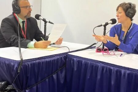 Photo of Kyle Gargaro, ACHR News, interviewing Miranda Berner, Berner Air Curtains for the AHR Expo Podcast