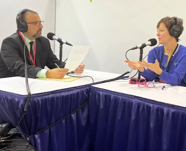 Photo of Kyle Gargaro, ACHR News, interviewing Miranda Berner, Berner Air Curtains for the AHR Expo Podcast